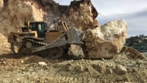 Caterpillar D8T Bulldozer Pushing Huge Stone